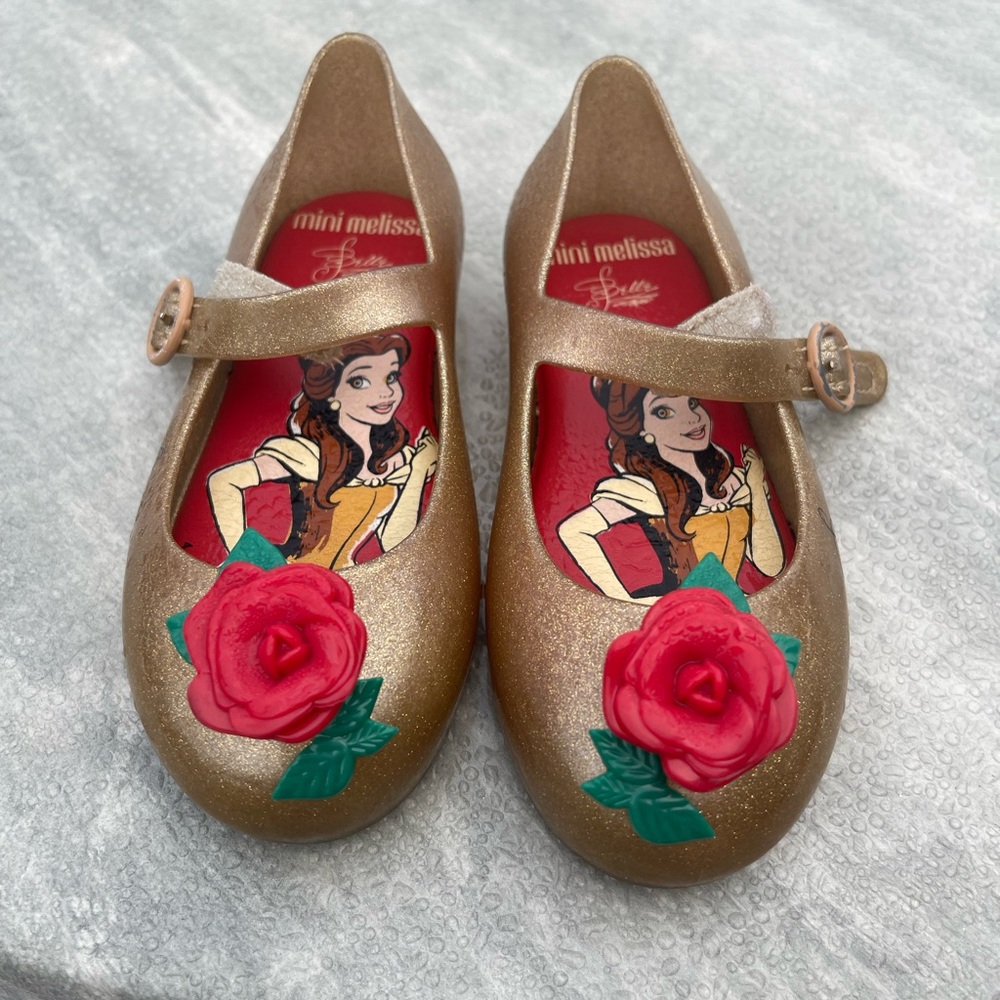 Mini Melissa Sparkling Gold Shoes with Red Floral Accent